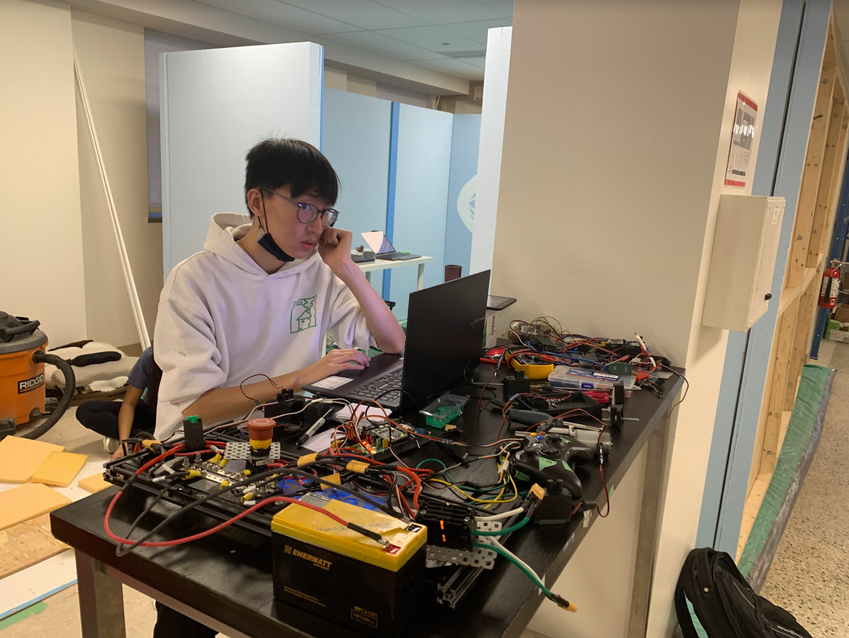 Zi Heng works on programming the ID system