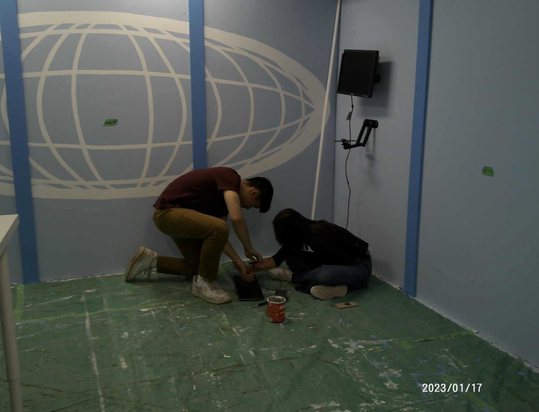 Yau and Audrey install the monitor and keyboard