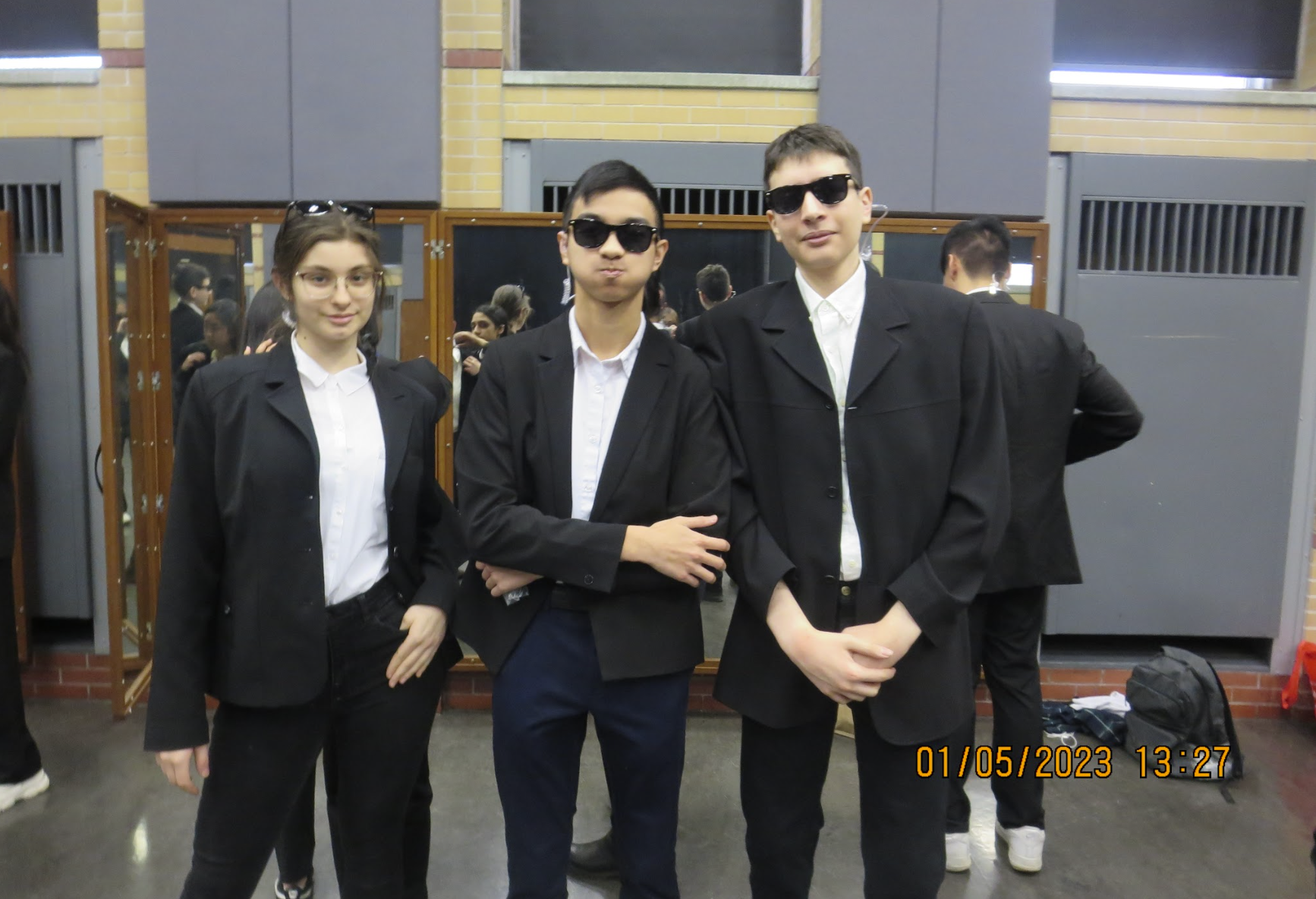 Adelina, Vincent, and Adam posing for the camera in sunglasses