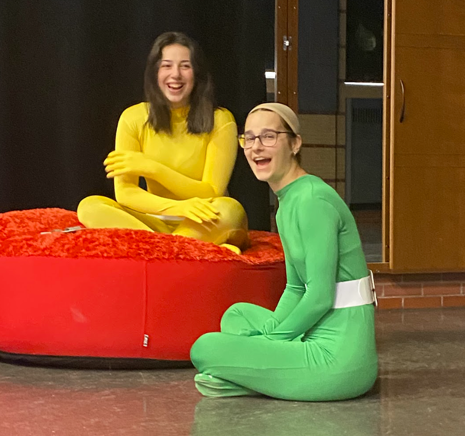 Zoe and Sofia in their spy suits laughing at the camera