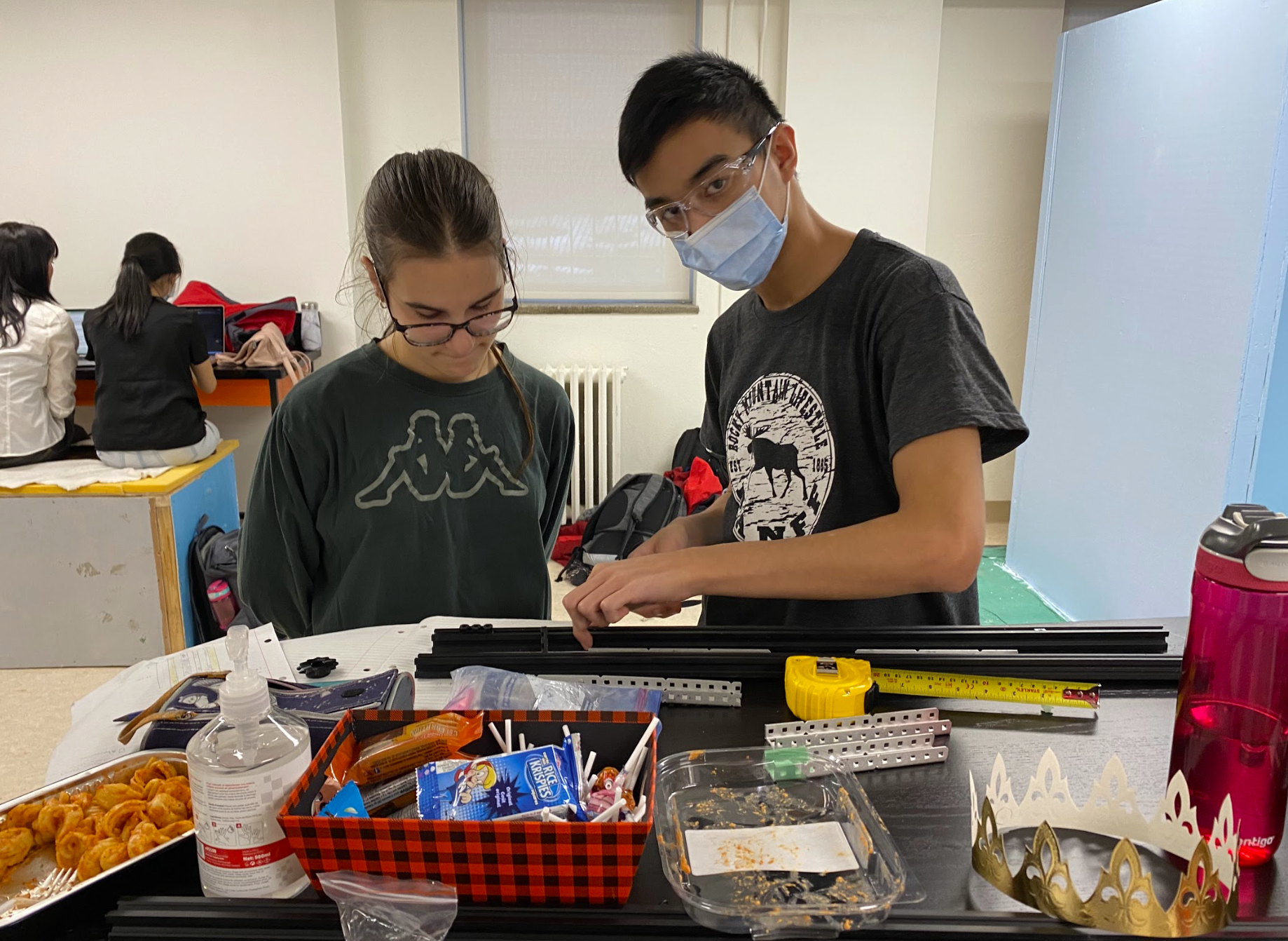 Sofia and Vincent work on the mechanical lift