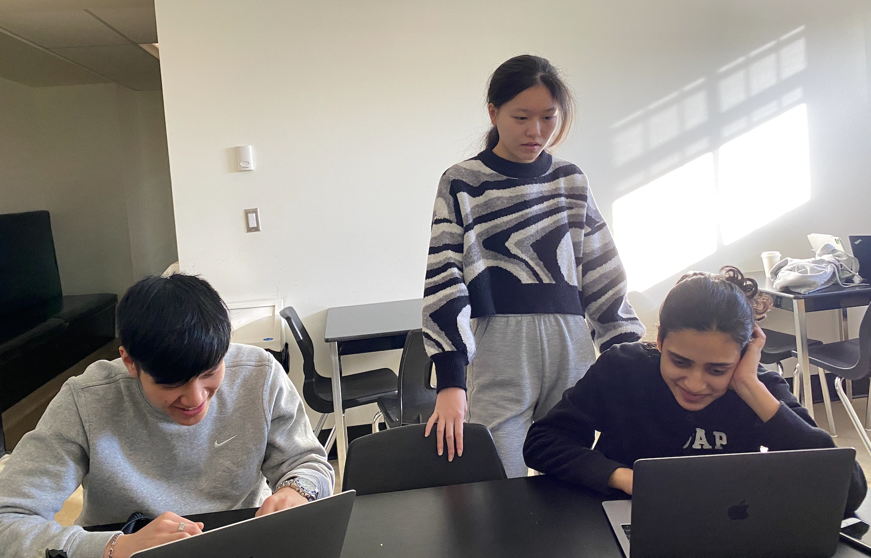 Yau, Elisa, and Sangeeta editing the video